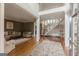 A spacious foyer featuring hardwood floors and staircase flowing into a living area at 217 Brunswick Dr, Tyrone, GA 30290