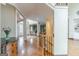 Elegant foyer with hardwood floors and staircase, with views to multiple rooms at 217 Brunswick Dr, Tyrone, GA 30290