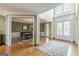 Bright foyer flows into the formal dining room with beautiful hardwood floors and natural light at 217 Brunswick Dr, Tyrone, GA 30290
