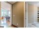 Inviting hallway showcasing hardwood floors and access to the living and dining areas at 217 Brunswick Dr, Tyrone, GA 30290
