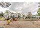Community playground with multiple slides, spring riders, and swings near the pool at 217 Brunswick Dr, Tyrone, GA 30290
