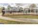 Community pool with a large white home and sun shelters in the background at 217 Brunswick Dr, Tyrone, GA 30290