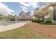 Community pool with a large slide and a large white home in the background at 217 Brunswick Dr, Tyrone, GA 30290