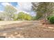 Spacious manicured lawn area with a walking path, trees, and seating at 217 Brunswick Dr, Tyrone, GA 30290
