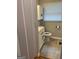 This bathroom has a toilet, sink, storage, and a window for natural light at 1079 Pine Ne St, Conyers, GA 30012