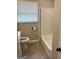 Bathroom featuring subway tiles in the shower, neutral colors, and modern fixtures at 1079 Pine Ne St, Conyers, GA 30012