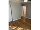 Cozy bedroom with hardwood floors, a ceiling fan, and a spacious closet at 1079 Pine Ne St, Conyers, GA 30012