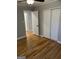 This bedroom features hardwood floors, a ceiling fan and closet doors at 1079 Pine Ne St, Conyers, GA 30012
