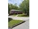 Exterior view of a one-story brick house with a walkway leading to the front door and a well-manicured lawn at 1079 Pine Ne St, Conyers, GA 30012