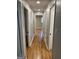 Hallway featuring hardwood flooring and doorways to adjacent rooms at 1079 Pine Ne St, Conyers, GA 30012