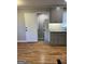 Well-designed kitchen with granite countertops, gray cabinets, and convenient layout at 1079 Pine Ne St, Conyers, GA 30012