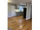 Charming kitchen featuring gray cabinets, granite countertops, and stainless steel appliances at 1079 Pine Ne St, Conyers, GA 30012