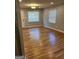 Living room with hardwood floors and lots of natural light at 1079 Pine Ne St, Conyers, GA 30012