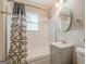 Bathroom with a shower-tub combination, a white vanity and tiled walls at 3614 Fairburn Nw Pl, Atlanta, GA 30331