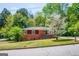 Charming red-brick home with well-manicured front lawn and mature flowering tree at 3614 Fairburn Nw Pl, Atlanta, GA 30331