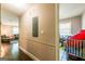 Hallway view of bedroom with toys, a crib, electrical box and hardwood flooring at 3614 Fairburn Nw Pl, Atlanta, GA 30331