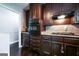 Kitchen with dark cabinetry, and stainless steel appliances at 3614 Fairburn Nw Pl, Atlanta, GA 30331