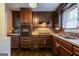 Kitchen with dark cabinetry, stainless steel sink, and modern microwave at 3614 Fairburn Nw Pl, Atlanta, GA 30331