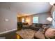 Comfortable living room with large sectional couch, and an adjacent dining area at 3614 Fairburn Nw Pl, Atlanta, GA 30331