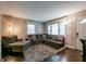 Comfortable living room with large sectional couch, and dark wood floors at 3614 Fairburn Nw Pl, Atlanta, GA 30331