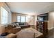 Cozy living room featuring a plush sectional, large TV, and dark wood floors at 3614 Fairburn Nw Pl, Atlanta, GA 30331