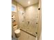 Modern bathroom features an enclosed glass shower with gray and white marble tiling at 11297 Serenbe Ln, Palmetto, GA 30268