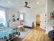Bright bedroom with hardwood floors, twin beds, white walls, and stylish decor at 11297 Serenbe Ln, Palmetto, GA 30268