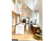 Modern kitchen with high ceilings, pendant lighting, stainless steel appliances and hardwood floors at 11297 Serenbe Ln, Palmetto, GA 30268