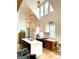 Bright, open kitchen with pendant lighting, white cabinets, and a large island at 11297 Serenbe Ln, Palmetto, GA 30268