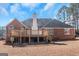 Expansive backyard with a spacious wooden deck, perfect for outdoor gatherings and serene relaxation at 5003 Samantha Ct, Mcdonough, GA 30252