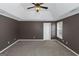 Bedroom with carpet floors and a tray ceiling is enhanced by two windows providing natural light at 5003 Samantha Ct, Mcdonough, GA 30252