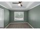 Bedroom with ceiling fan and ample natural light from a large window at 5003 Samantha Ct, Mcdonough, GA 30252
