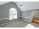 Carpeted bedroom with large window and vaulted ceiling at 5003 Samantha Ct, Mcdonough, GA 30252