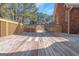 Spacious wooden deck providing an outdoor living space with views of the surrounding neighborhood at 5003 Samantha Ct, Mcdonough, GA 30252