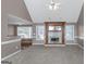 Spacious living room with fireplace, large windows, and neutral carpet, perfect for relaxation at 5003 Samantha Ct, Mcdonough, GA 30252