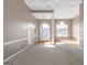 Bright, spacious living room with hardwood floors, neutral carpet, and elegant white trim and fixtures throughout at 5003 Samantha Ct, Mcdonough, GA 30252