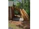 Exterior wooden staircase leading to an upper level with brick siding and lush greenery nearby at 5003 Samantha Ct, Mcdonough, GA 30252