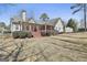 Spacious backyard showcasing the deck/patio area and the house's architectural design at 35 Ryans Ct, Sharpsburg, GA 30277