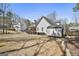 View of the backyard featuring a storage shed and the property's spacious layout at 35 Ryans Ct, Sharpsburg, GA 30277