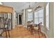 Sunny breakfast area with hardwood floors, a view of the staircase, and modern lighting at 35 Ryans Ct, Sharpsburg, GA 30277