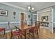 Dining room featuring a hardwood table with chairs, chandelier, open doorway and views to the kitchen at 35 Ryans Ct, Sharpsburg, GA 30277