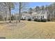 Exterior view of a beautiful home with a spacious yard and a welcoming front porch at 35 Ryans Ct, Sharpsburg, GA 30277