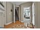 Home foyer with hardwood floors, decorative rug, and open view to the staircase and Primary bedroom at 35 Ryans Ct, Sharpsburg, GA 30277