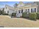 Charming white two-story home with a welcoming front porch and manicured landscaping at 35 Ryans Ct, Sharpsburg, GA 30277