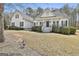 Charming white two-story home with a welcoming front porch and manicured landscaping at 35 Ryans Ct, Sharpsburg, GA 30277