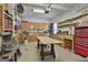 Spacious garage with ample storage cabinets, workbenches, and tools, perfect for projects at 35 Ryans Ct, Sharpsburg, GA 30277