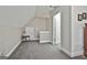 Hallway with natural light and neutral walls leading to a door at 35 Ryans Ct, Sharpsburg, GA 30277