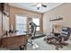 Inviting office features a ceiling fan, work desk, and comfortable seating space with a cozy rug at 35 Ryans Ct, Sharpsburg, GA 30277