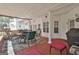 Outdoor porch with dining and seating area perfect for social gatherings and a grill at 35 Ryans Ct, Sharpsburg, GA 30277
