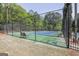 Community tennis court with a net and fencing, providing a recreational amenity for residents at 35 Ryans Ct, Sharpsburg, GA 30277